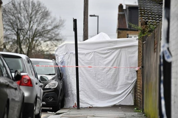 A police forensics tent at the scene of the fatal shooting of a teenager in north London on Monday night
PHOTO: AFP