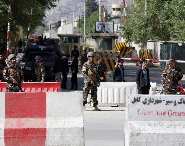 Afghan security forces stand guard near the site of a blast in Kabul, Afghanistan April 30, 2018.  PHOTO: REUTERS