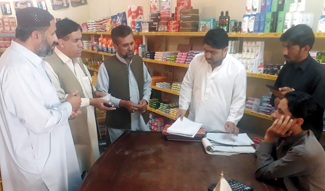 District administration officials checking the price list. PHOTO: EXPRESS