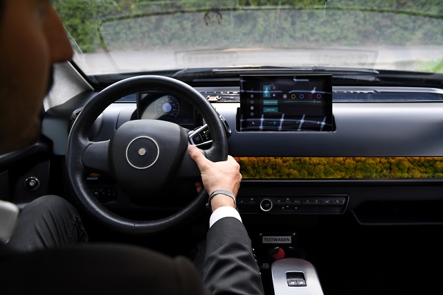 An employee of German solar car company Sono Motors holds the steering wheel of the prototype car "Sion" in Munich, Germany, August 1, 2018.
PHOTO: REUTERS