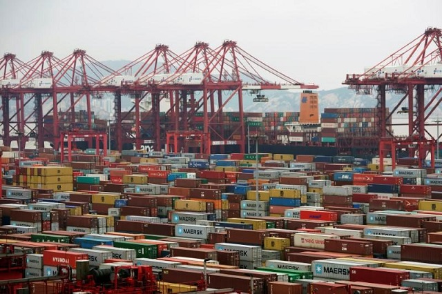 Containers are seen at the Yangshan Deep Water Port in Shanghai, China April 24, 2018. PHOTO: REUTERS