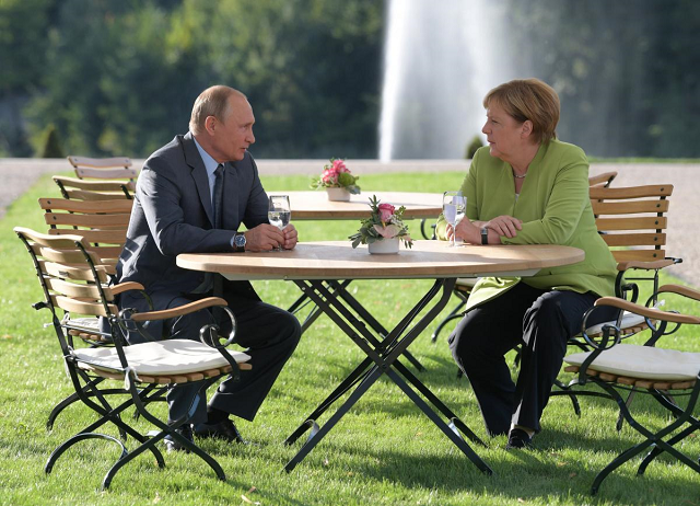 Chancellor Angela Merkel and President Vladimir Putin. 
PHOTO: REUTERS