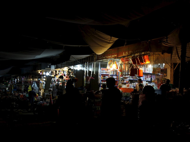 A general view of a market with shops powered by generators. Photo: Reuters