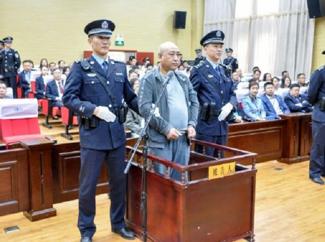 Gao Chengyong, a serial killer dubbed China's "Jack the Ripper" for the way he mutilated several of his 11 female victims, is sentenced in court in Baiyin. PHOTO: AFP