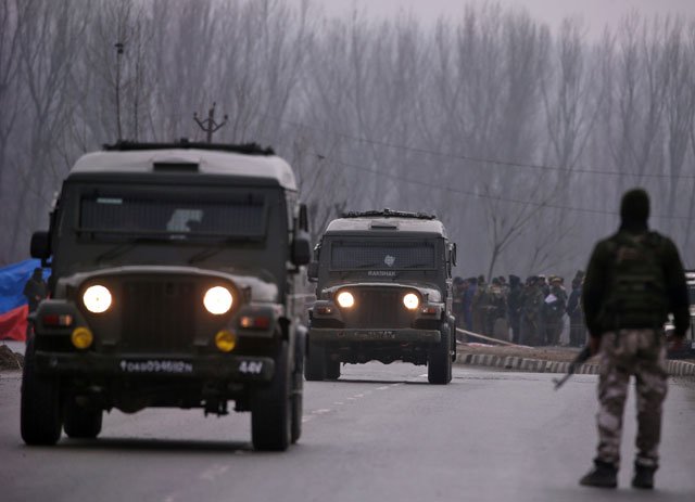Indian soldiers stand guard near the site of Thursday's suicide bomb attack in occupied Kashmir’s Pulwama district February 15, 2019. PHOTO: REUTERS