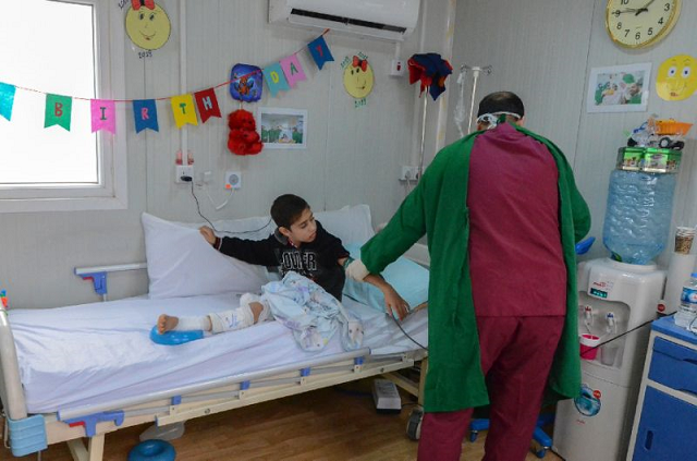 A patient receives treatment at the Doctors Without Borders (MSF) hospital in Iraq's Mosul. PHOTO: AFP