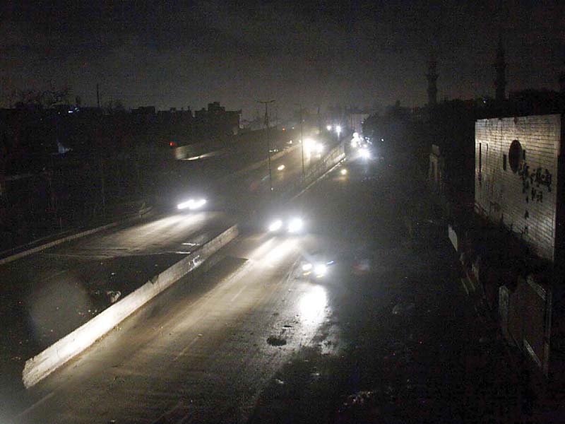 Several areas of Karachi plunged into darkness as rain disrupted power supply in the city for more than 12 hours. PHOTO: ONLINE