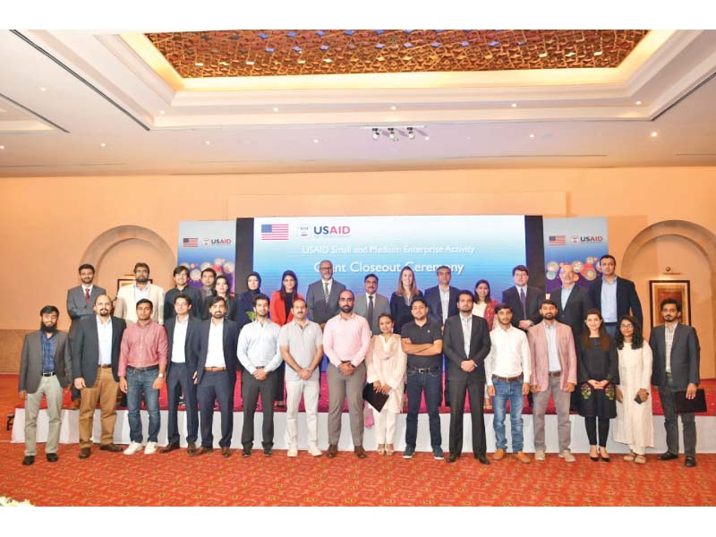 Challenge Fund grant recipients stand along with USAID Mission Director Julie Koenen at the grants closing ceremony held in Islamabad. PHOTO: EXPRESS