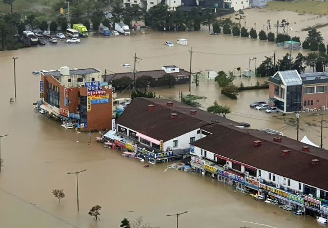 Typhoon Mitag left floods and landslides in its wake after it lashed South Korea. PHOTO: AFP