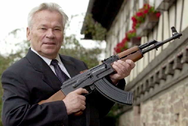 Russian general Mikhail Kalashnikov poses with his famous assault rifle in 2002. PHOTO: AFP