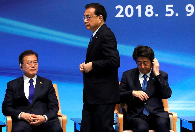 Japan's Prime Minister Shinzo Abe, South Korea's President Moon Jae-in and China's Premier Li Keqiang attend the 6th JAPAN-CHINA-KOREA Business Summit in Tokyo. PHOTO: Reuters