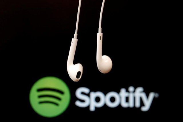 Headphones are seen in front of a logo of online music streaming service Spotify in this  February 18, 2014 illustration picture. 
PHOTO: REUTERS