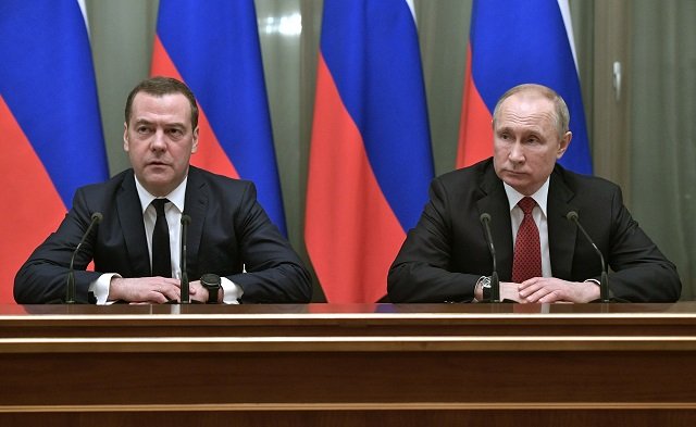 Russian President Vladimir Putin and Prime Minister Dmitry Medvedev meet with members of the government in Moscow on January. PHOTO: AFP