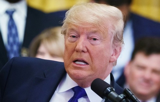 US President Donald Trump's (pictured January 17, 2020) defense team said that the impeachment process is a "brazen and unlawful attempt to overturn the results of the 2016 election". PHOTO: AFP