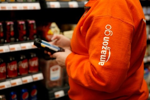 Amazon associate Cindy Umipig checks inventory at a smaller format Amazon Go store in the Blue Shift Amazon office space at 300 Pine Street in downtown Seattle, Washington, US, December 10, 2018. PHOTO: REUTERS