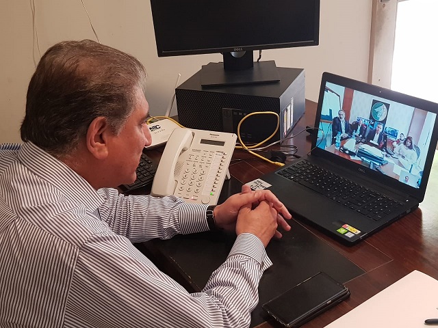 Foreign Minster Shah Mehmood Qureshi  chairing a meeting while being in self-isolation. PHOTO: EXPRESS