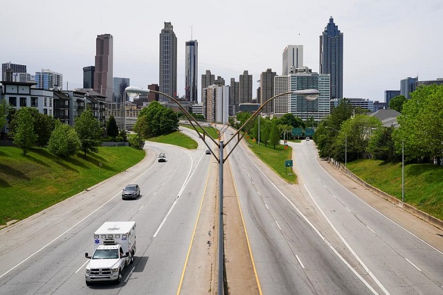 An ambulance is seen in the foreground of the Atlanta skyline days before the phased reopening of businesses and restaurants from coronavirus disease (COVID-19) restrictions in Atlanta, Georgia, US April 22, 2020 (PHOTO: REUTERS)