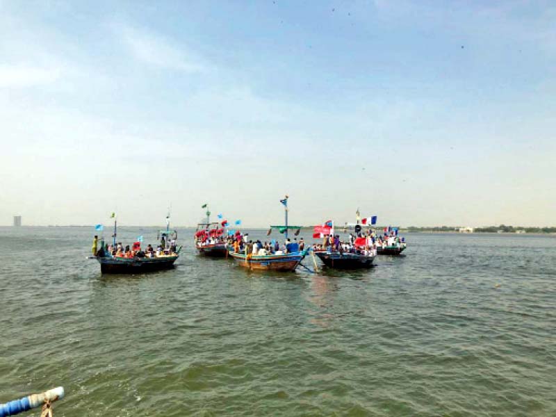 Protesters loaded on 25 boats made their way to Bhandar and Dingi on Thursday, to register their protest against develop-ment on the islands. However, they were blocked from reaching Dingi. PHOTO: EXPRESS