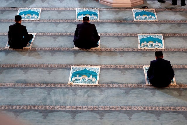 Clergymen get ready for a prayer marking the Muslim festival of Eidul Azha, while maintaining social distance amid the coronavirus disease (COVID-19) outbreak, in Moscow's grand mosque in Russia July 31, 2020. PHOTO: REUTERS
